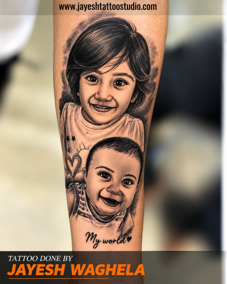 Black-and-grey family portrait tattoo on an arm showing two smiling portraits, heart details and My world lettering